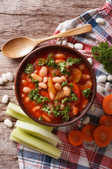 bean soup with ingredients close up. vertical top view
