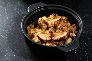 Potatoes baked with sausage and bacon
