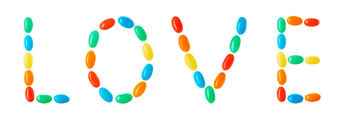 "LOVE" lettering made of multicolored candies isolated on white