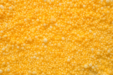 Macro shot of pellets of colored modelling wax