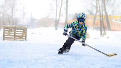 the boy plays hockey