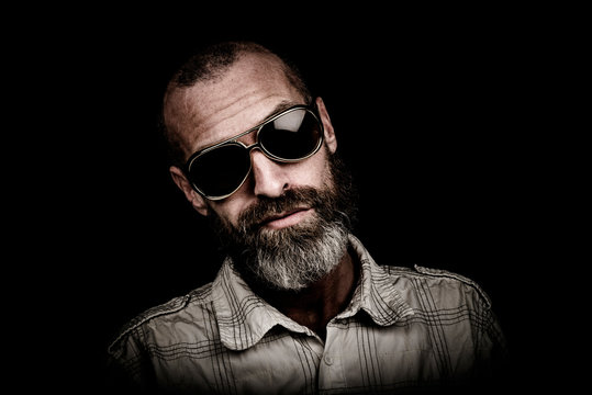 Portrait of a man with beard and sunglasses