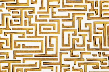 golden labyrinth textured background on black