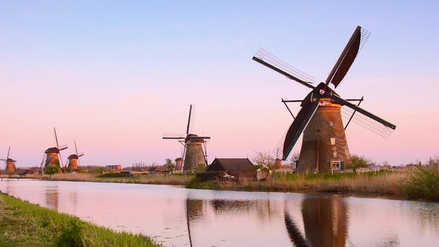 The picturesque landscape with aerial mill on the channel in Kinderdiyk, Netherlands. Full HD video (High Definition). retro style