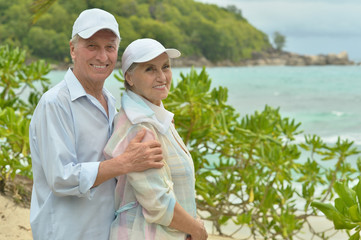 elderly couple rest at tropical resort