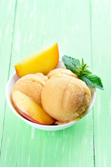 Peach sorbet with fresh fruit slices