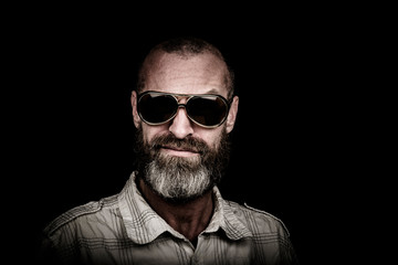 Portrait of a man with beard and sunglasses