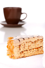 Slice of layered honey cake isolated
