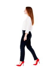 walking redhead business woman.