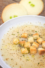 French onion soup on wooden table