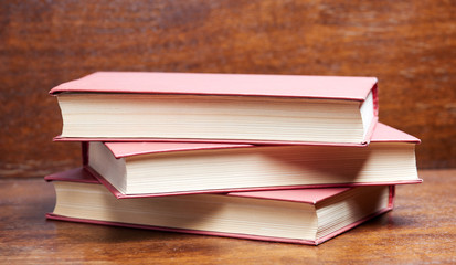 Three books on table