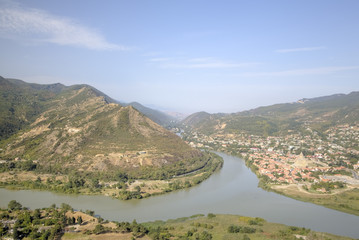 Fototapeta na wymiar Confluence of two rivers - Kura and Aragvi. Mtskheta, Georgia
