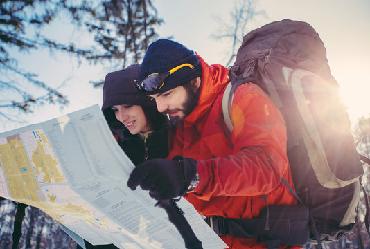 Young couple of hikers looking for direction