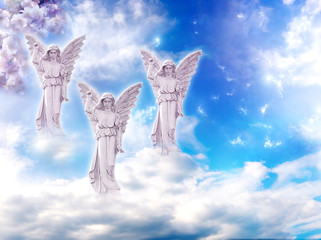 three angels over mystical cloudy sky