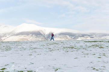 The Lake District, Keswick, England, 01/17/2016, Snowy field with snow covered mountains in the background