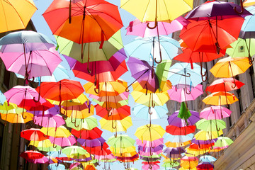 Fototapeta na wymiar The Alba Iulia street decorated with colored and open umbrellas in Timisoara, Romania