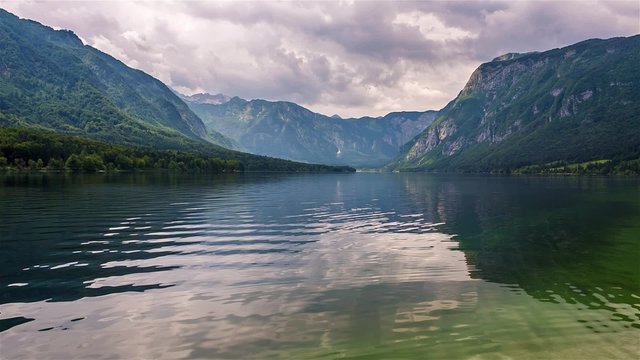 Bohinj lake, a glacial lake in Slovenia, with Julian Alps in the background