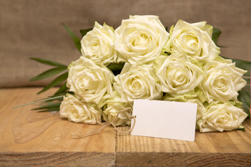White roses bouquet.Wedding card.