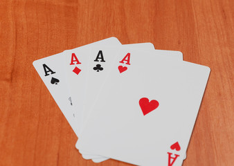 Old playing cards on wooden background