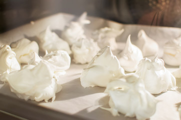 Obraz na płótnie Canvas soft sugar meringues bake in the oven