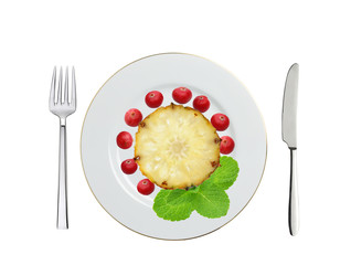 plate with sweet slice of pineapple, cranberry and mint herb, kn