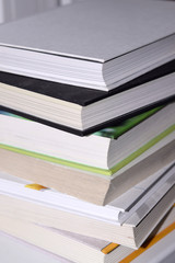 Many different colored books in hardcover