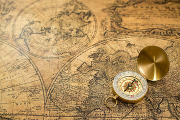 Fototapeta na wymiar old compass on vintage map