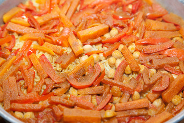 Closeup of rice covered with sweet pepper