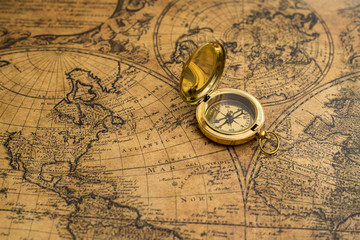 old compass on vintage map