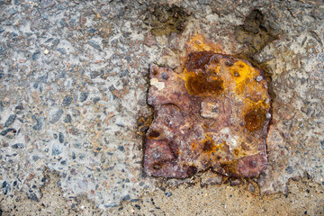  concrete with rusted metal elements