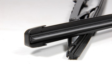 detail of automotive windshield wipers new and old style