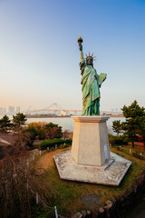 Statue of Liberty and Rainbow bridge at Odaiba Tokyo © chairedevil