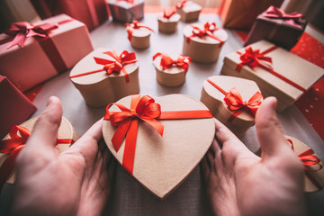 Wrapping cool gifts heart for Valentine's Day.