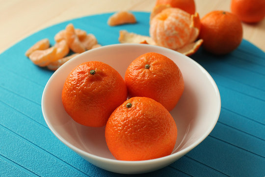 Tangerines on a plate.