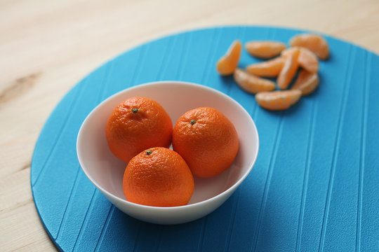 Tangerines on a plate.