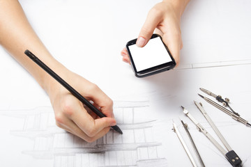 Architect working on blueprint. Architects workplace - architectural project, blueprints, ruler,...