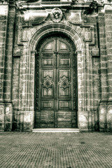 Fototapeta na wymiar Door of Parish Church of Mellieha, HDR black and white photograp