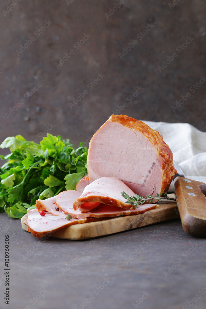 Wall mural piece of roasted meat (ham) with pepper and thyme