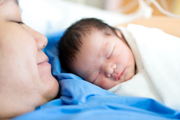 Asian mother with newborn baby in the hospital © alice_photo