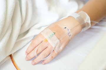 Close up of Asian woman patient in hospital with saline intraven