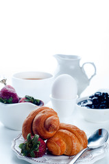 Breakfast with coffee and croissants