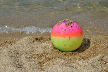 Fototapeta na wymiar Colorful Beach Ball on a Beach