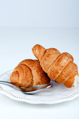 two croissants on a saucer sweets