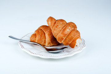 two croissants on a saucer sweets