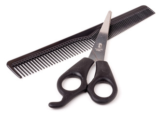 Comb and scissors isolated on the white background