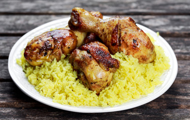 Baked chicken legs with yellow rice