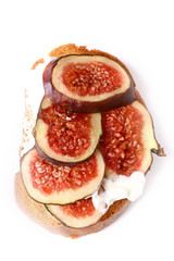 toast with figs and cream cheese on a white background