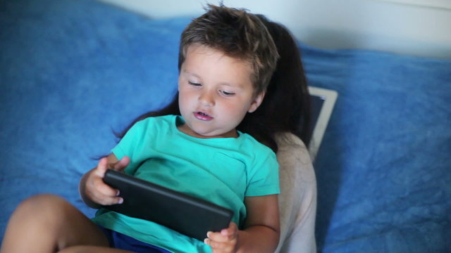 boy playing on the tablet