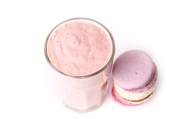 berry smoothie and macaroon on a white background yogurt breakfast