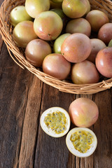 Passion fruit in the basket on wood background